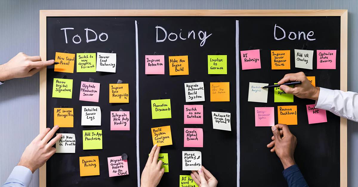 Woman using neat planner for productivity tips with pen and coffee on desk